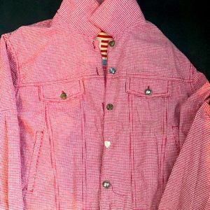 100% cotton denim style jacket. Unique button trim.